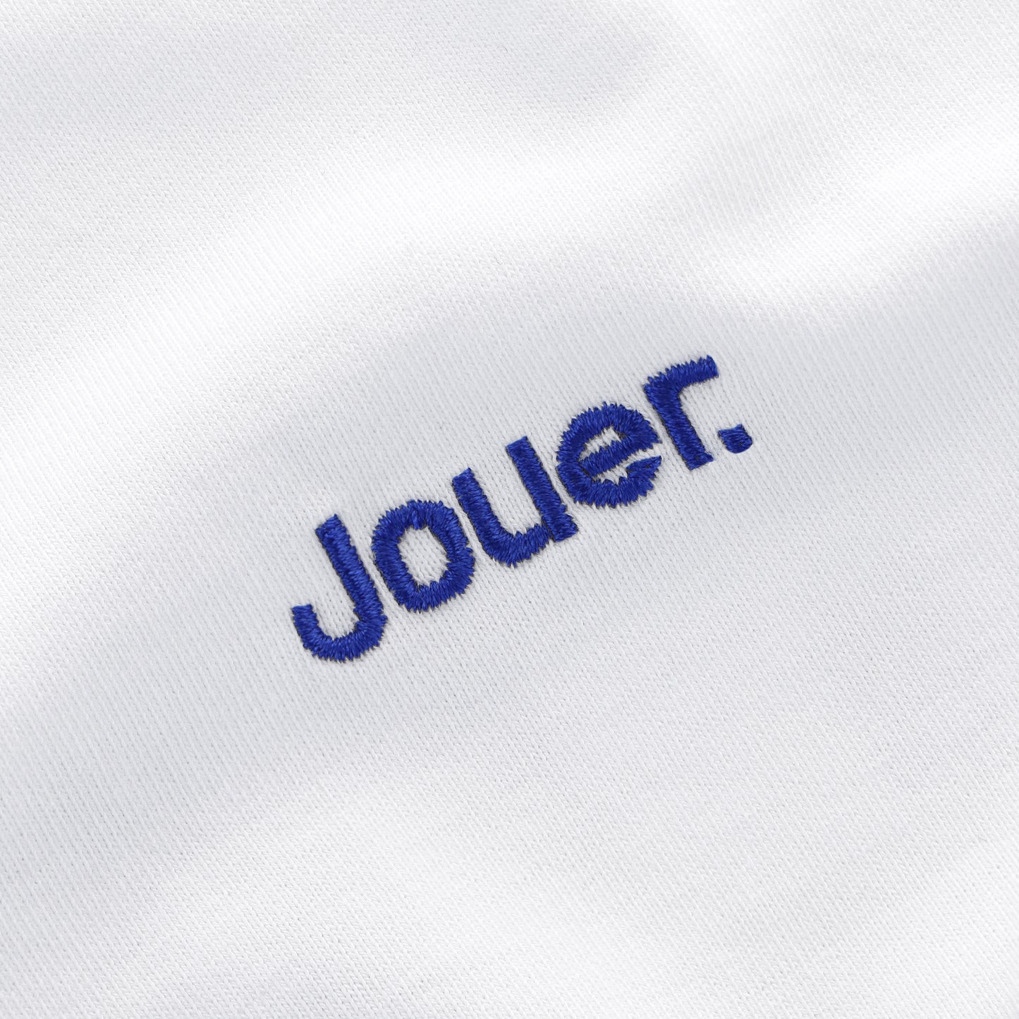 White 'Jouer' fundamental T-shirt with blue embroidered logo on the front and bold back print.