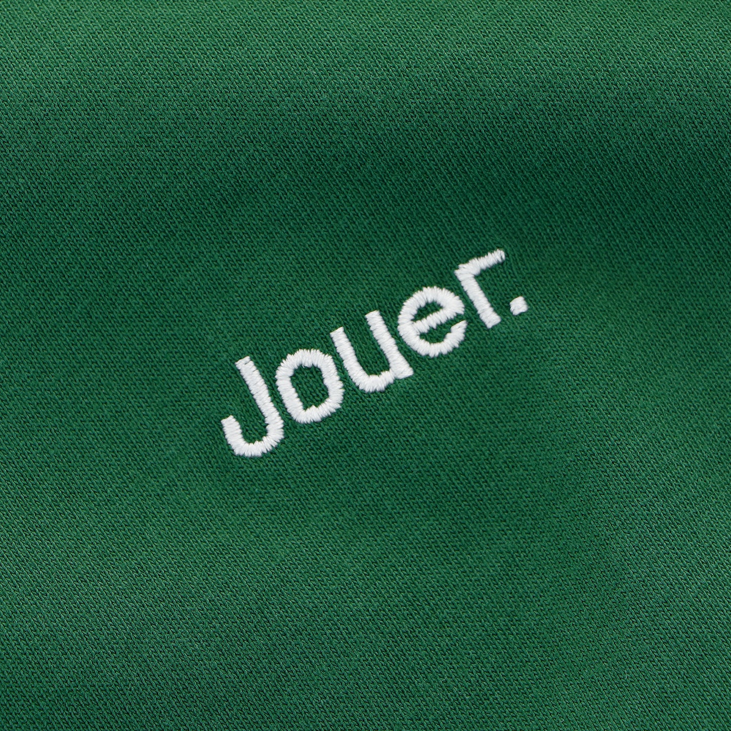 Green 'Jouer' T-shirt with white embroidered logo on the front and heart-themed sports back print.